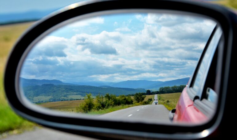 Beautiful picture of the landscape seen through the rearview mirror